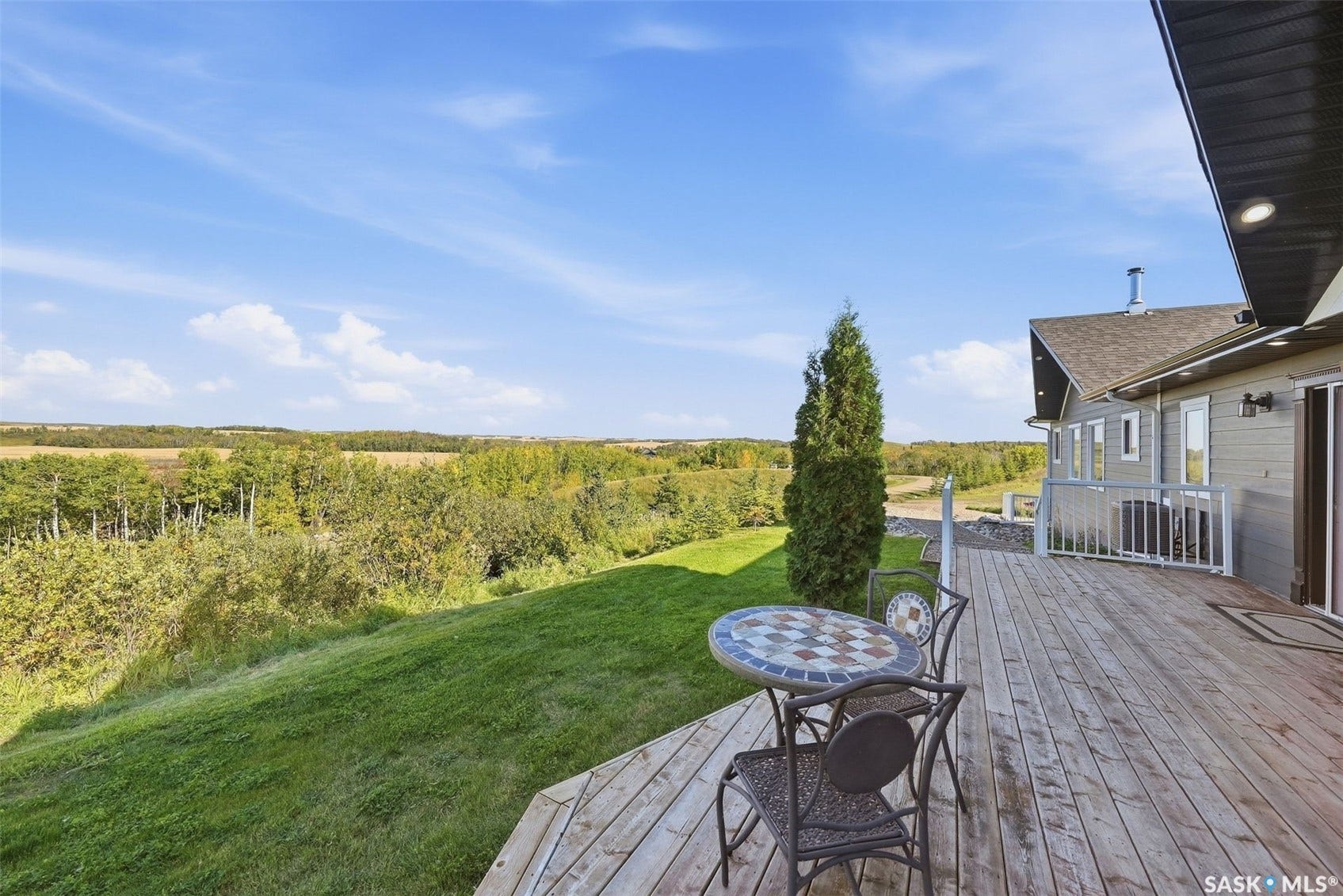 Expansive wood-plank deck with white railings