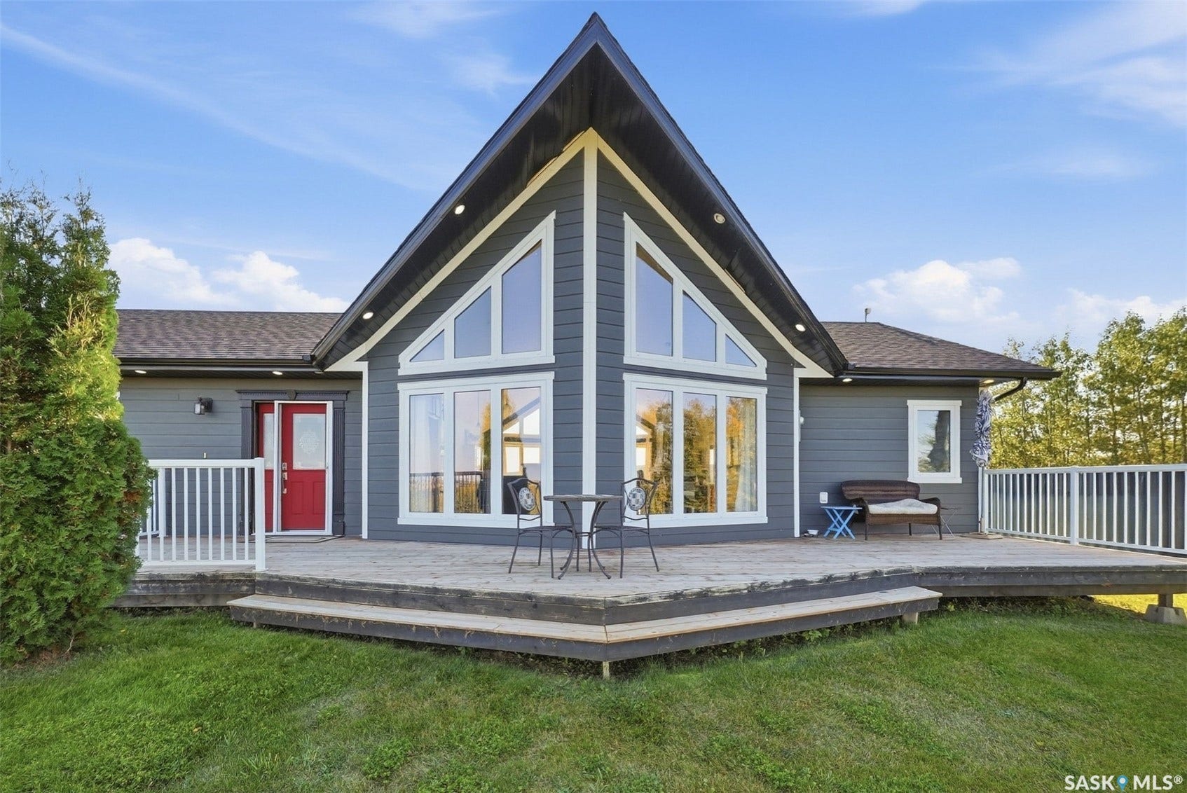 Modern exterior with dark gray siding and white trim
