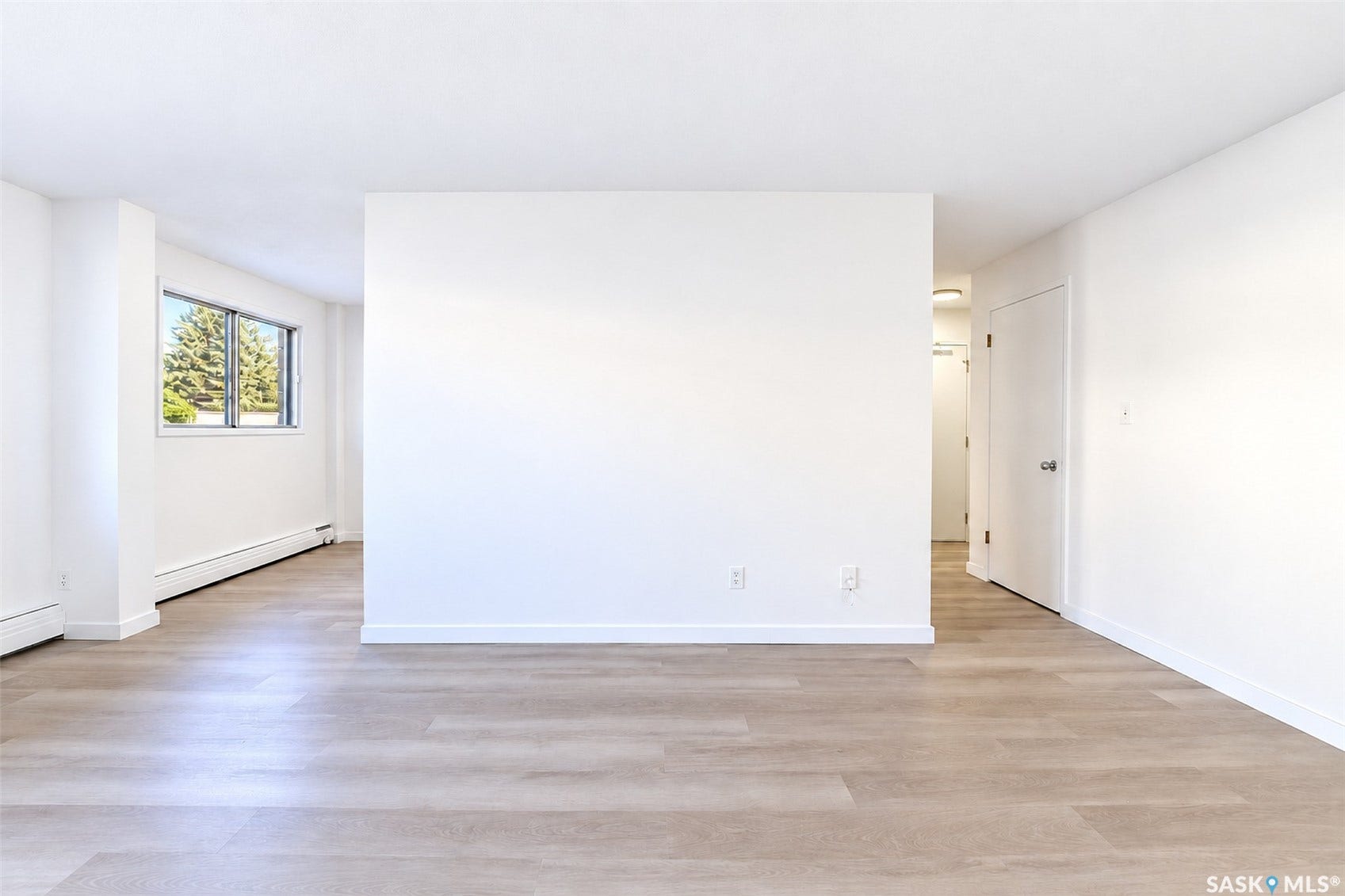 Neutral-toned wood-finish flooring throughout