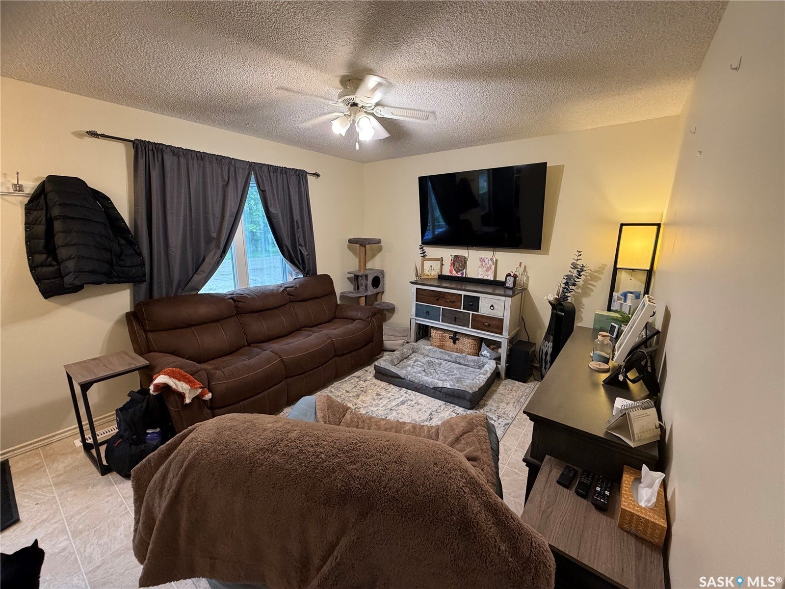 301 2nd Street, #1-10, Kennedy SK S0G 2R0 Recessed window, ceiling fan, and textured ceiling