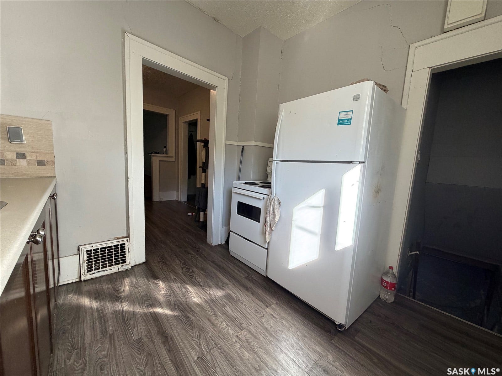 kitchen with entry to dining area and basement