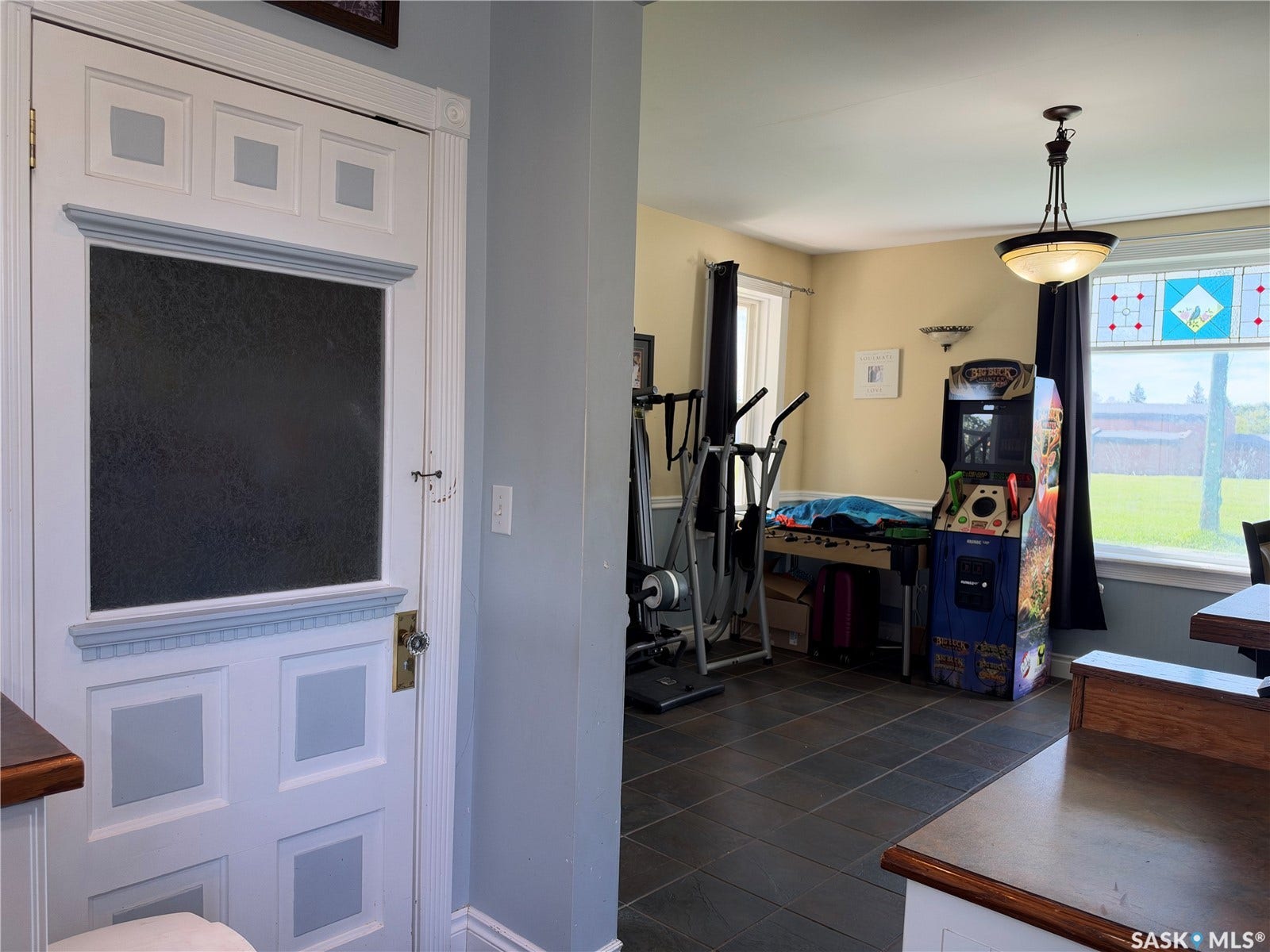 Decorative interior door with a paneled design and frosted glass insert