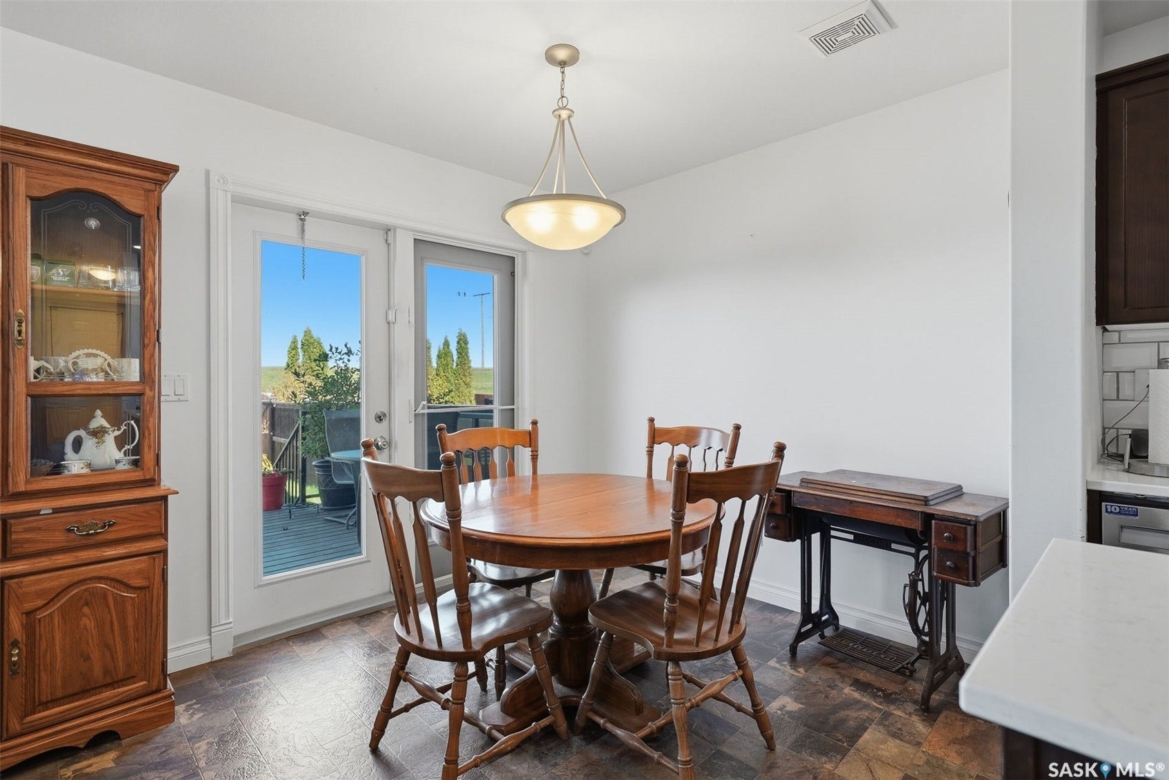 Recessed lighting and a semi-flush mount fixture illuminate the space