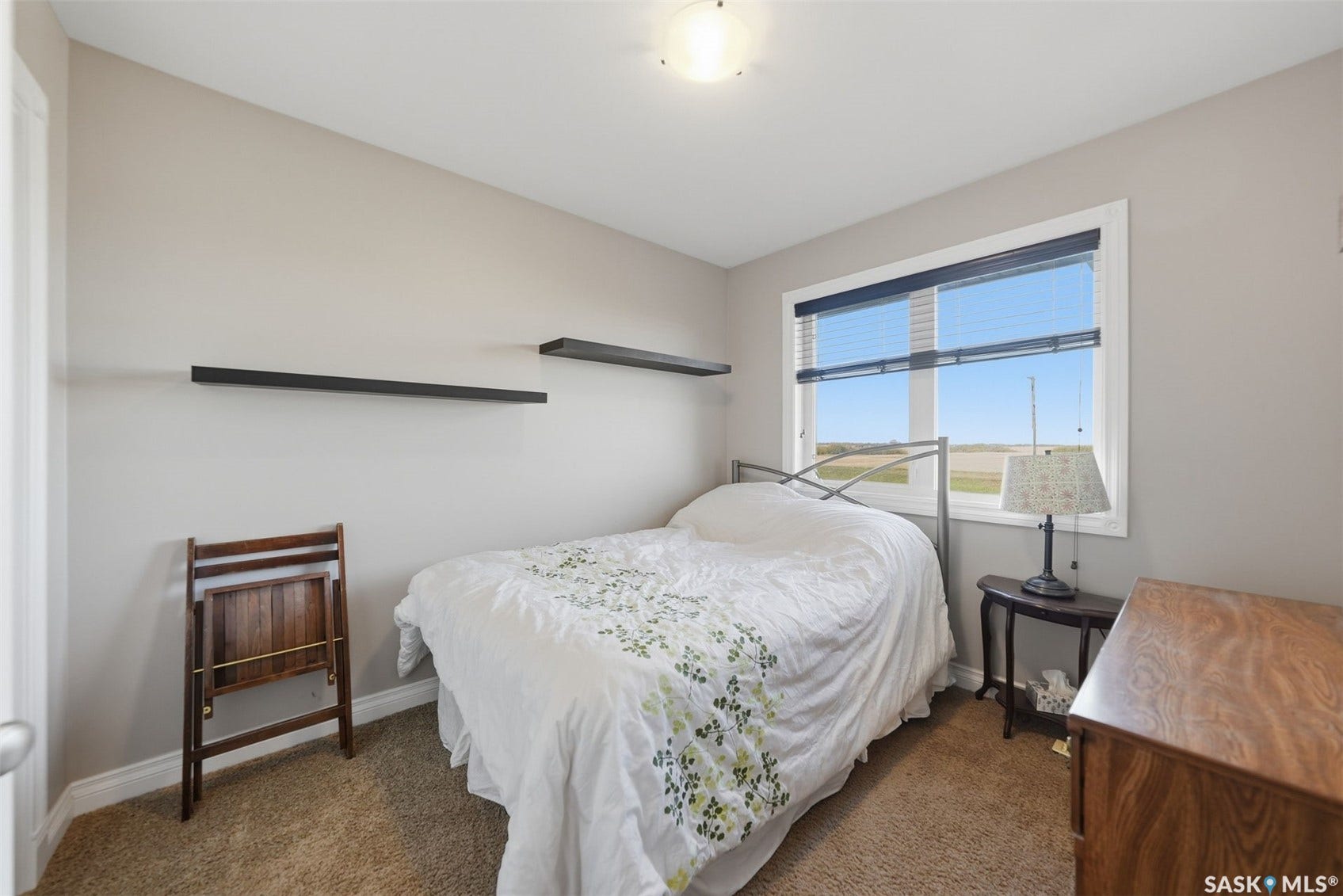 Recessed ceiling lighting, light neutral wall paint, white trim, and a window with blinds