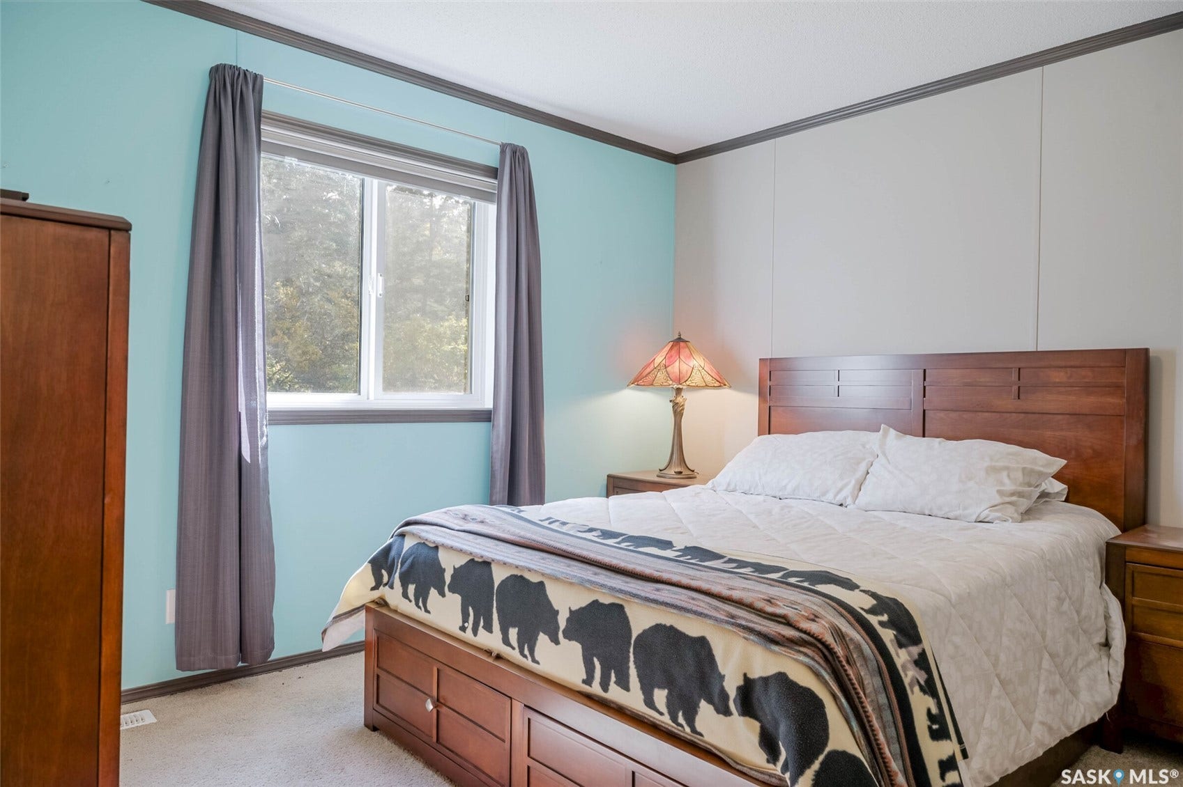 Window with outdoor scenery, recessed lighting, and wall paneling