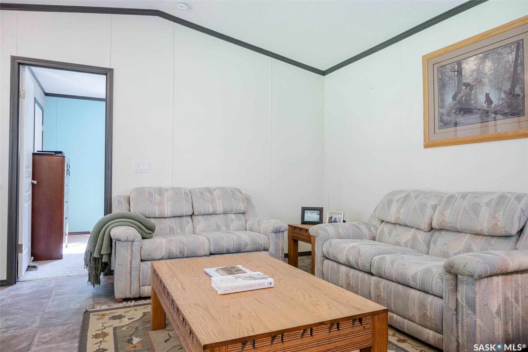 Wood-finish flooring with a contrasting area rug