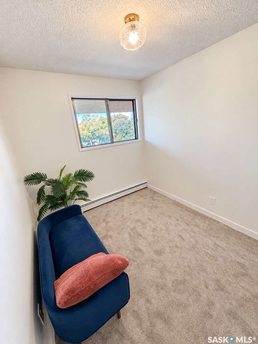 Wall-to-wall carpeting and white walls