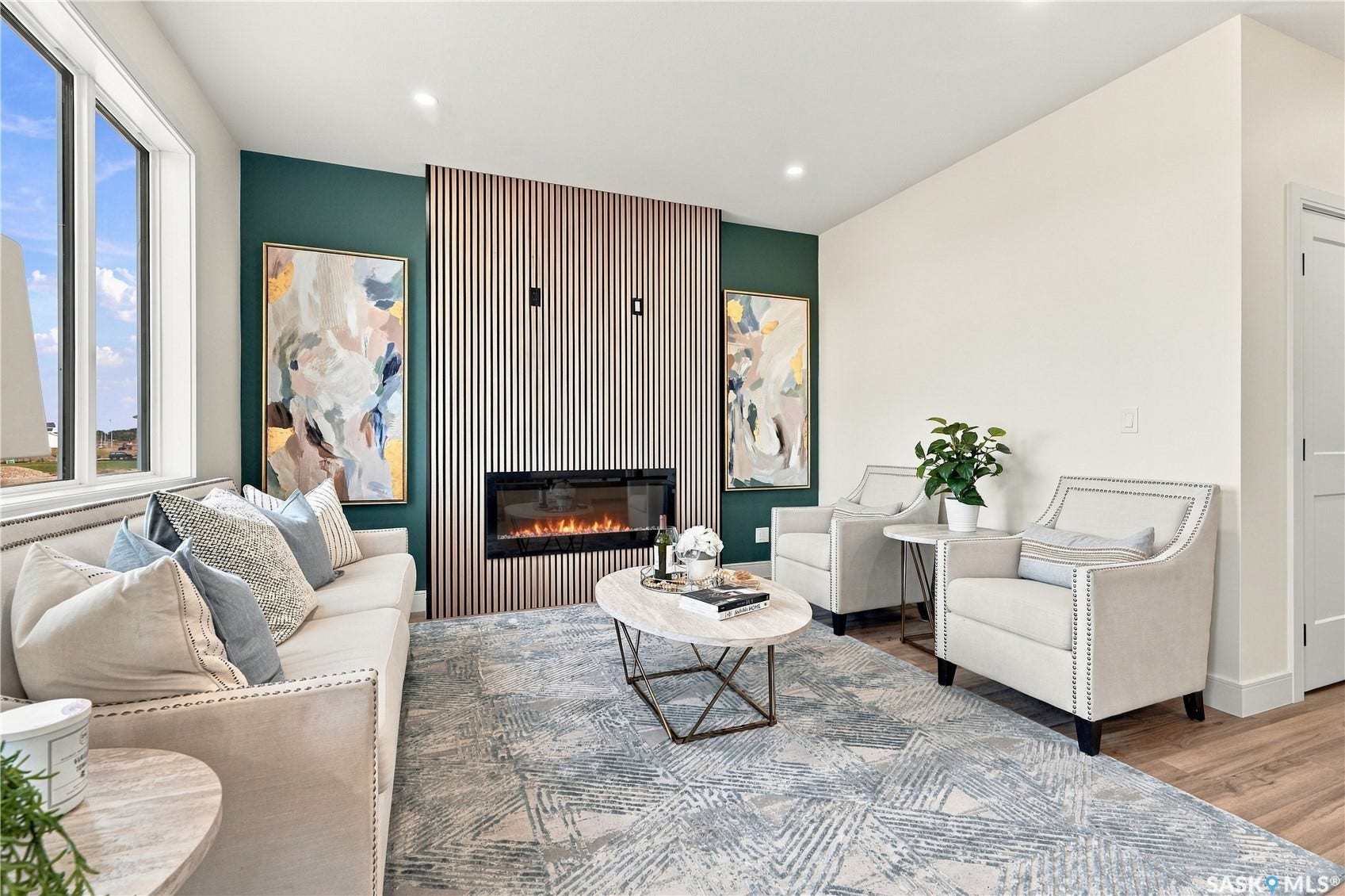 Accent wall with vertical wood slat paneling, electric fireplace, and recessed lighting