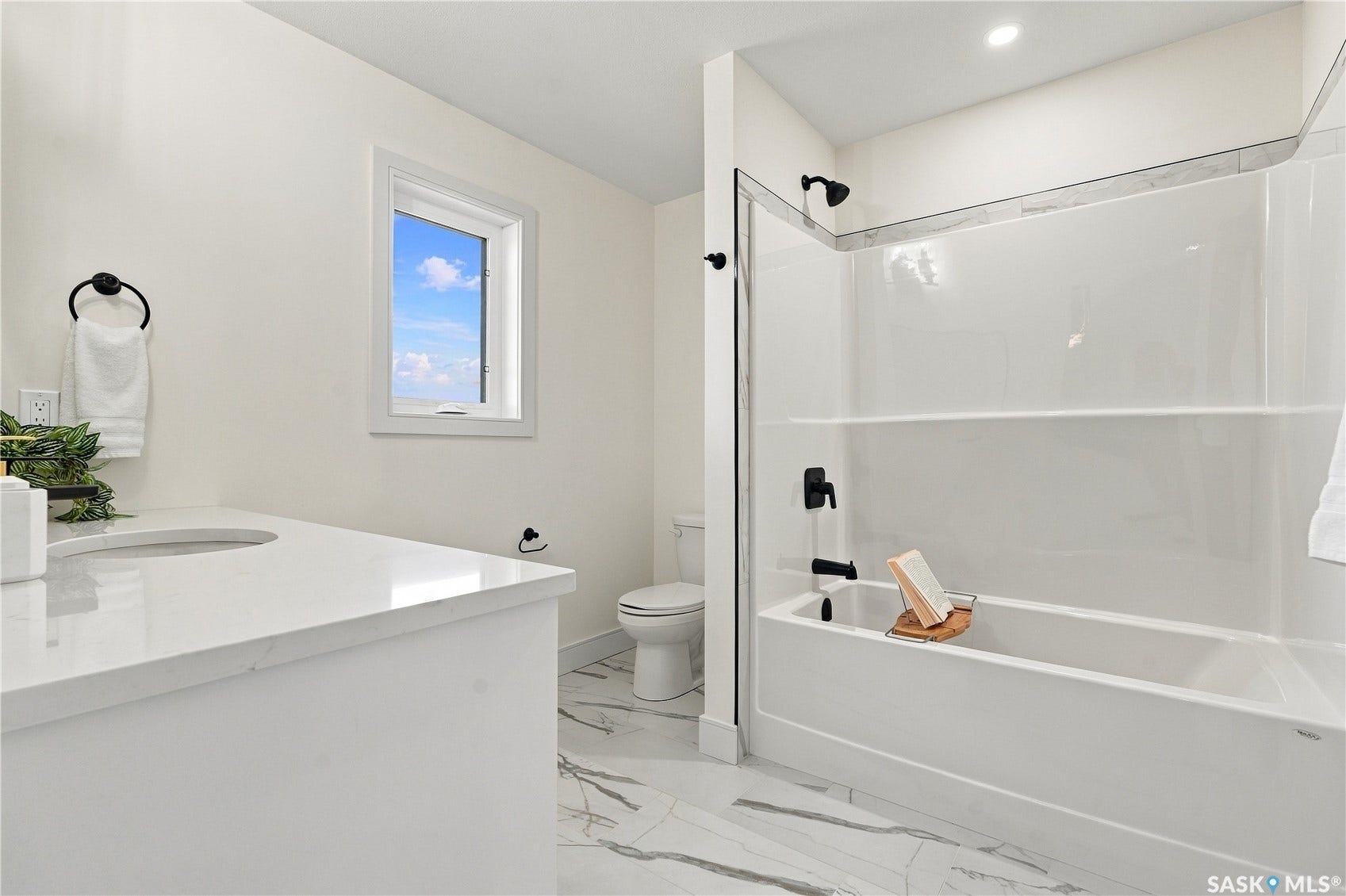 White vanity with an integrated sink and countertop
