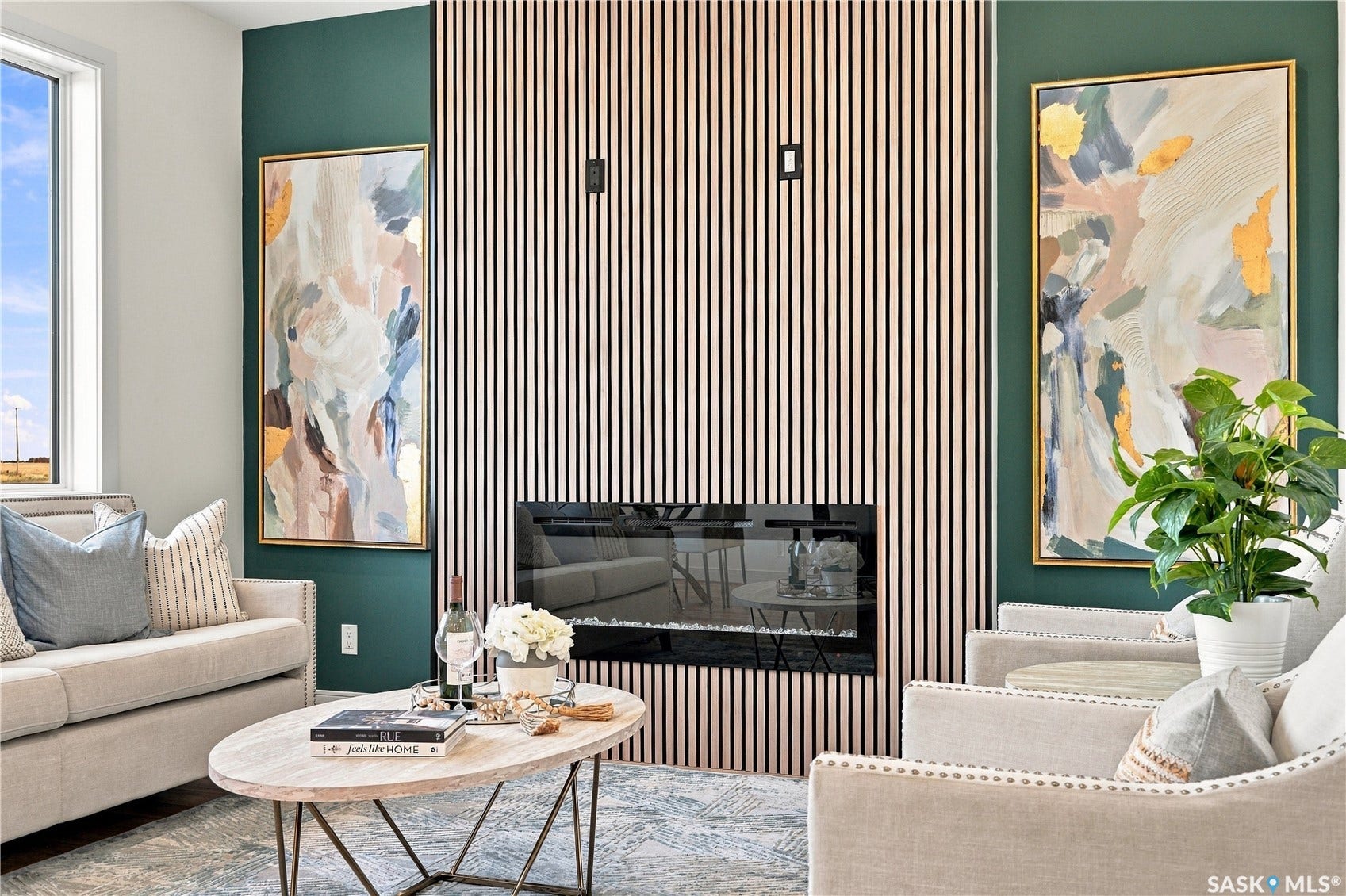 Feature wall with vertical wood slat detailing and an integrated linear electric fireplace