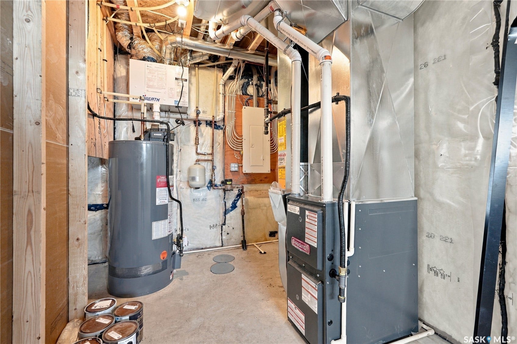 Mechanical room with hot water heater and forced-air furnace