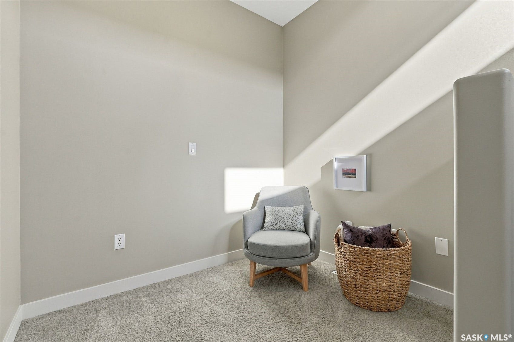 Finished attic space with sloped ceilings, neutral wall finishes, and carpeted flooring
