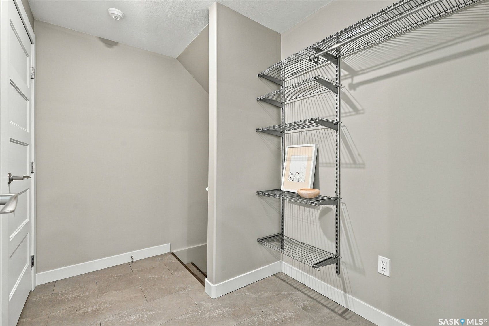 Custom closet organization system with wire shelving and hanging rod
