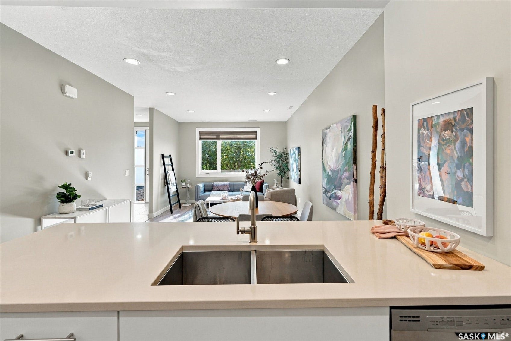 Kitchen island with an undermount stainless steel sink and a stainless steel faucet