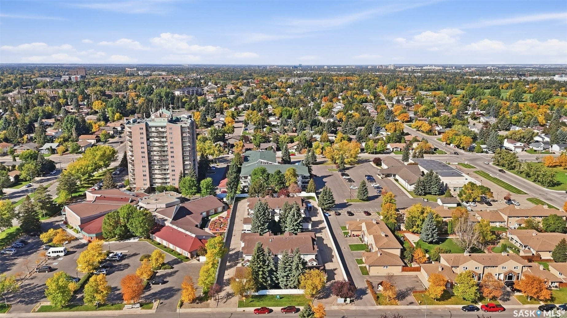 Aerial perspective featuring a residential neighborhood with a mix of multi-story and single-story buildings