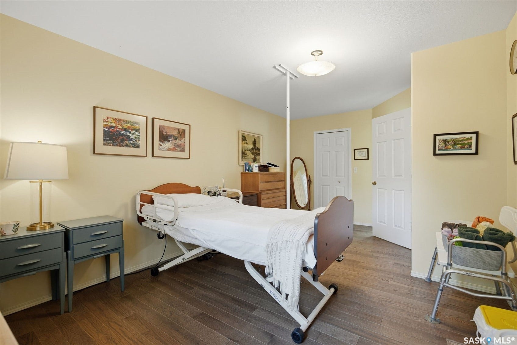 Wood-finish flooring with light-colored walls and white trim