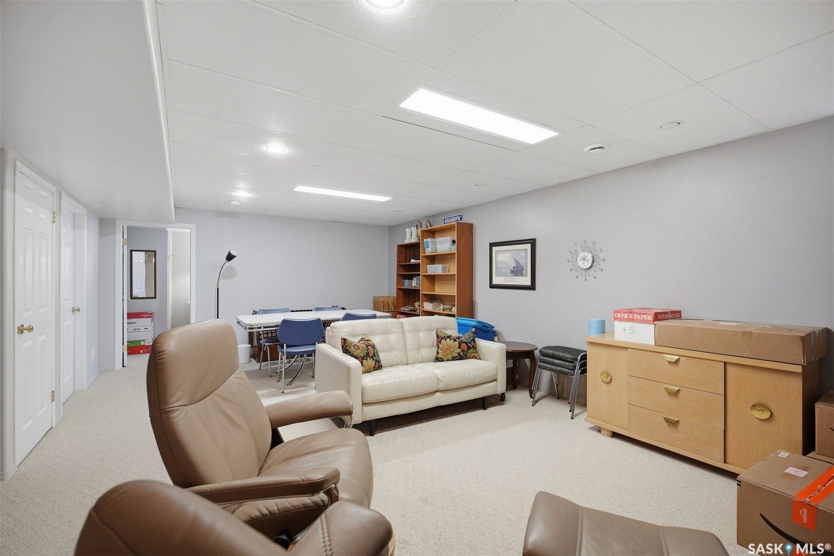 Recessed lighting, drop ceiling, neutral-toned walls, and carpeted flooring
