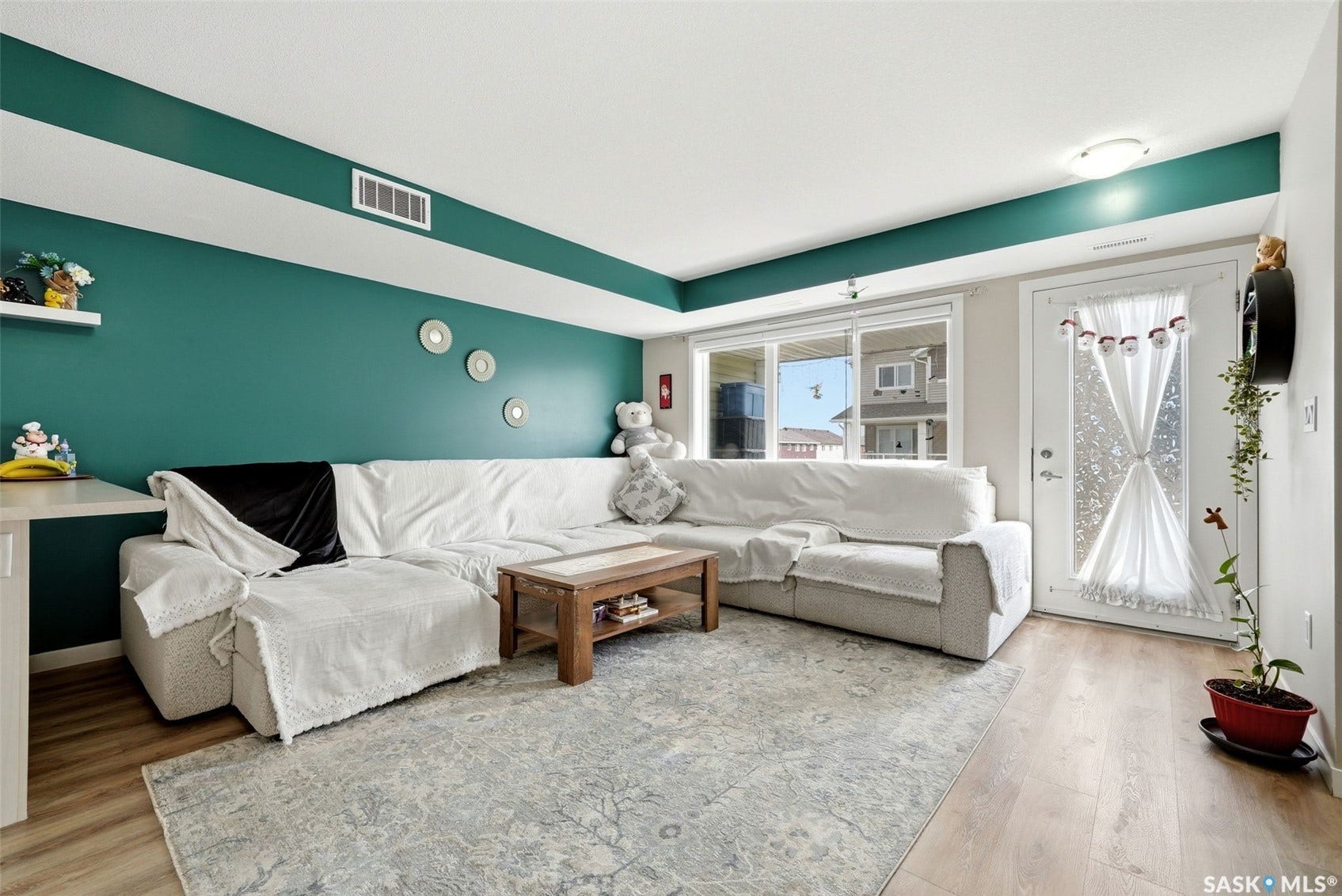 Wood-finish flooring, sliding glass door, and a permanent wall shelf
