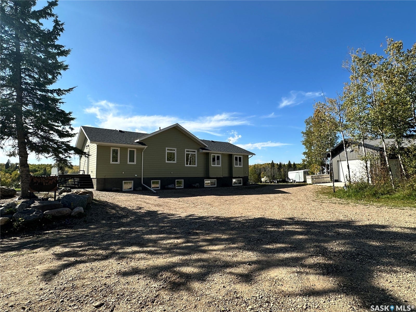 Light green exterior with multiple windows
