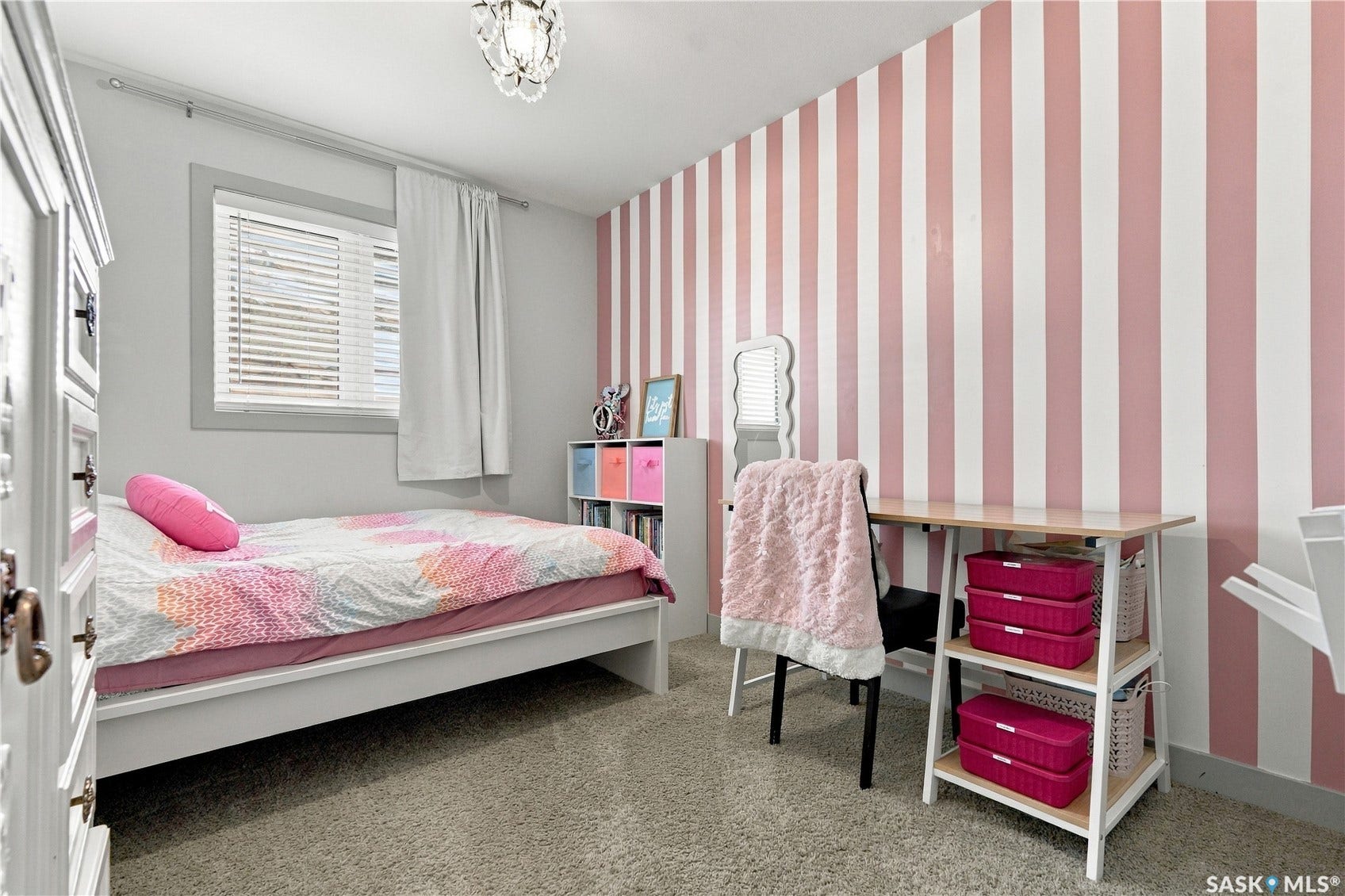 2nd floor bedroom with pink stripe accent wall and carpet flooring
