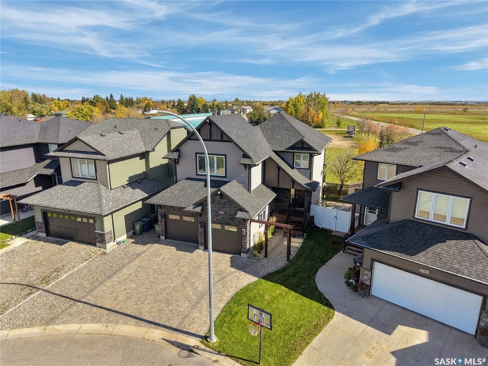 Paved cul-de-sac with manicured lawn