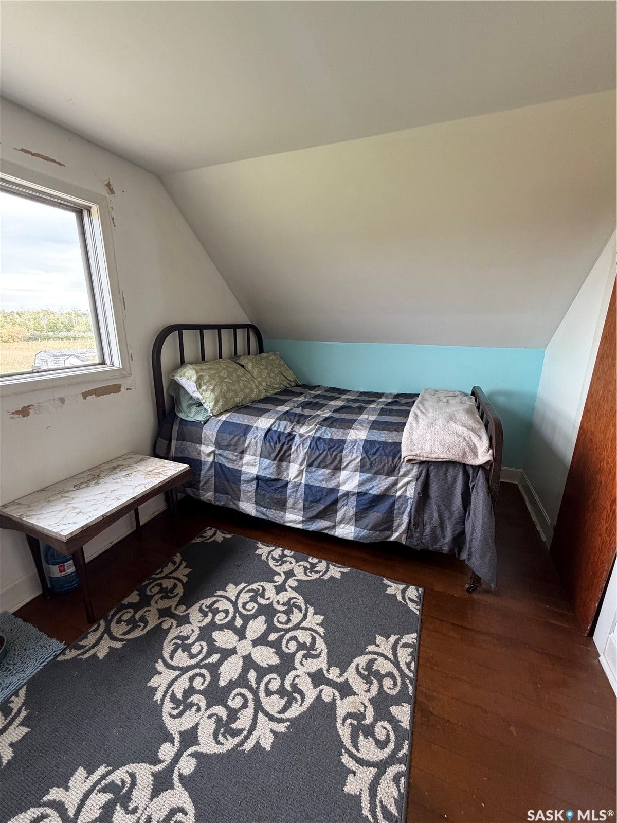 Hardwood flooring, painted walls, window with exterior exposure, sloped ceiling