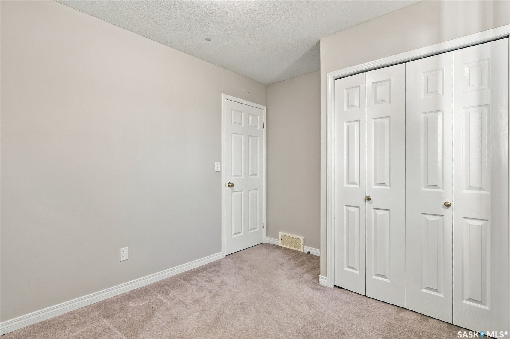 Carpeted flooring with painted walls