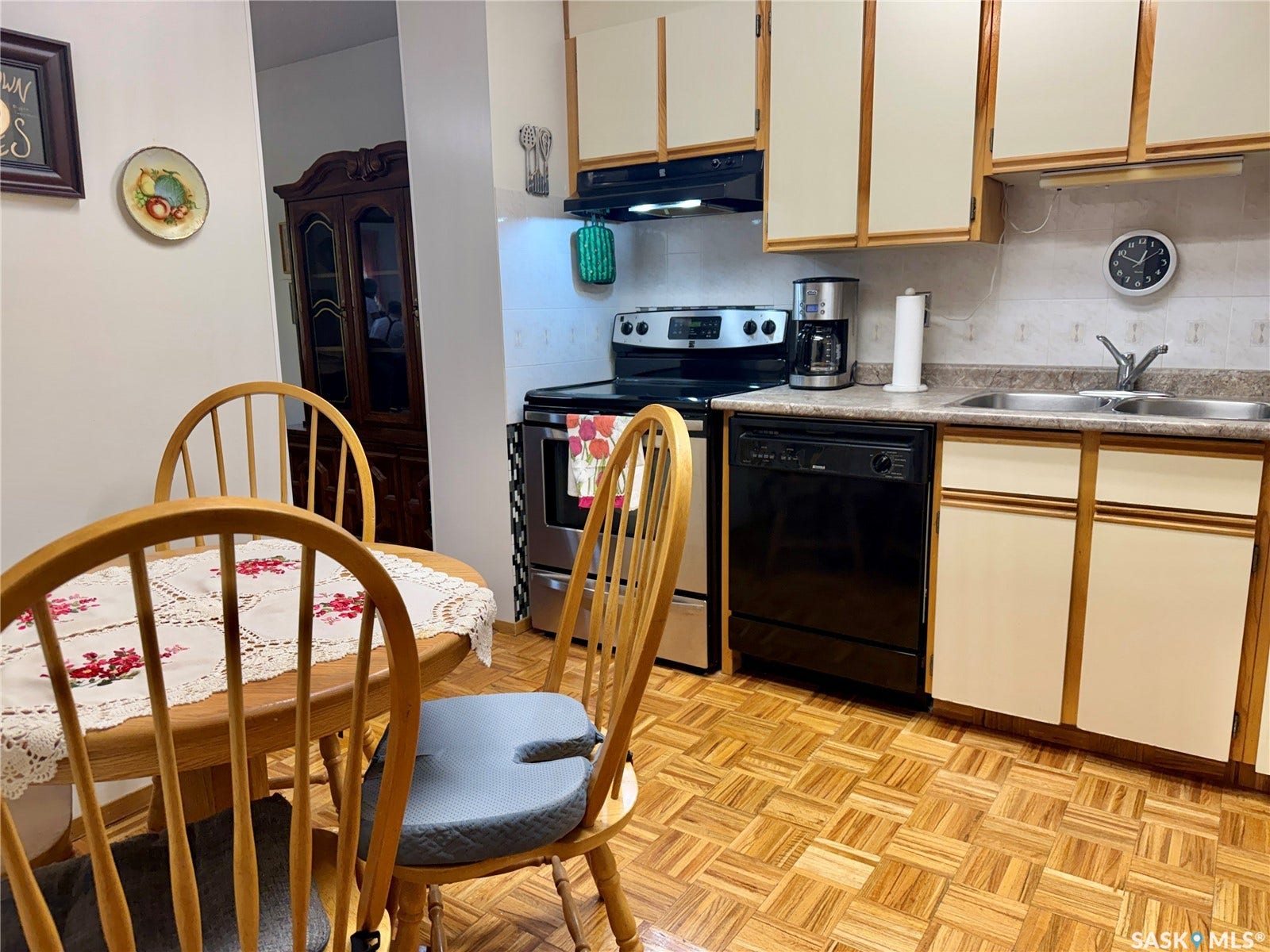 Kitchen featuring wood-finish flooring.