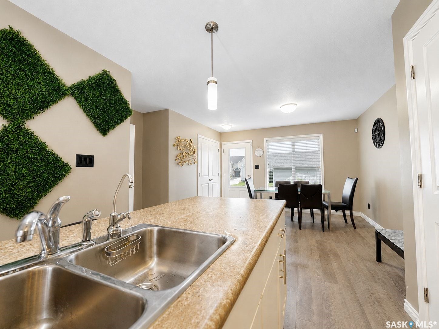 Kitchen island with double basin stainless steel sink and chrome fixtures