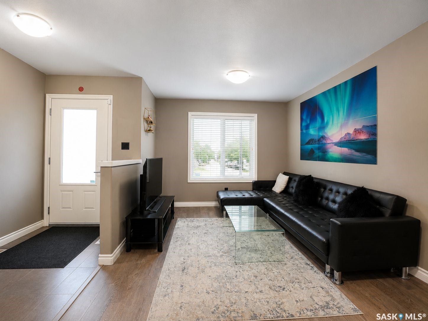 Wood-finish flooring throughout, complemented by neutral wall tones