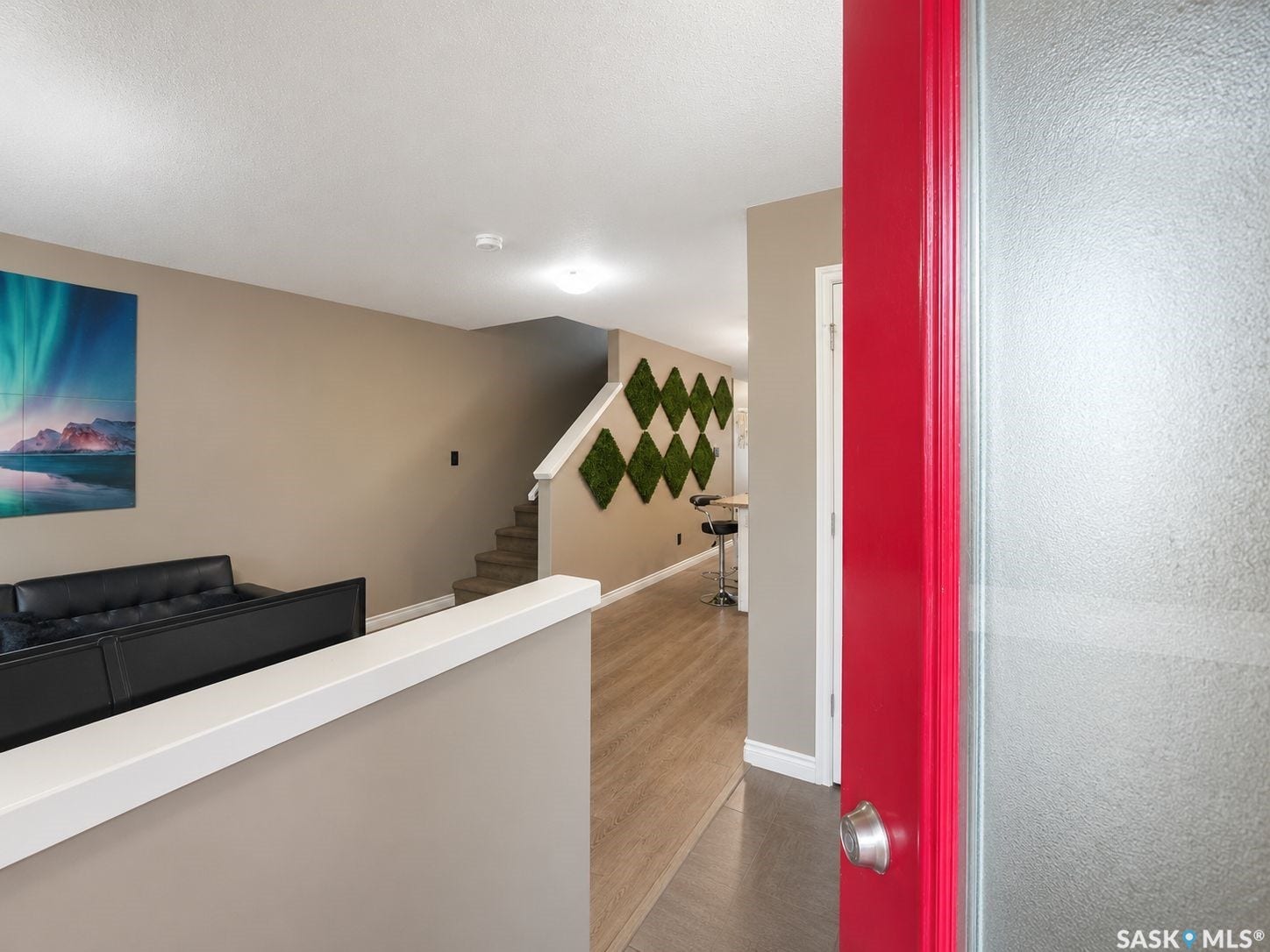 Red entrance door with frosted glass panel