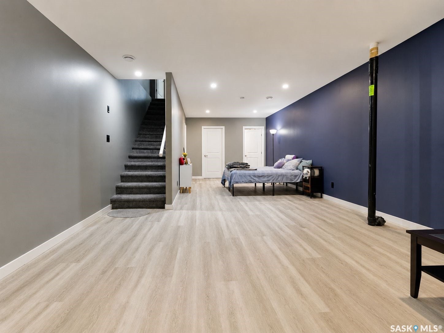 Light wood-finish flooring with recessed ceiling lights