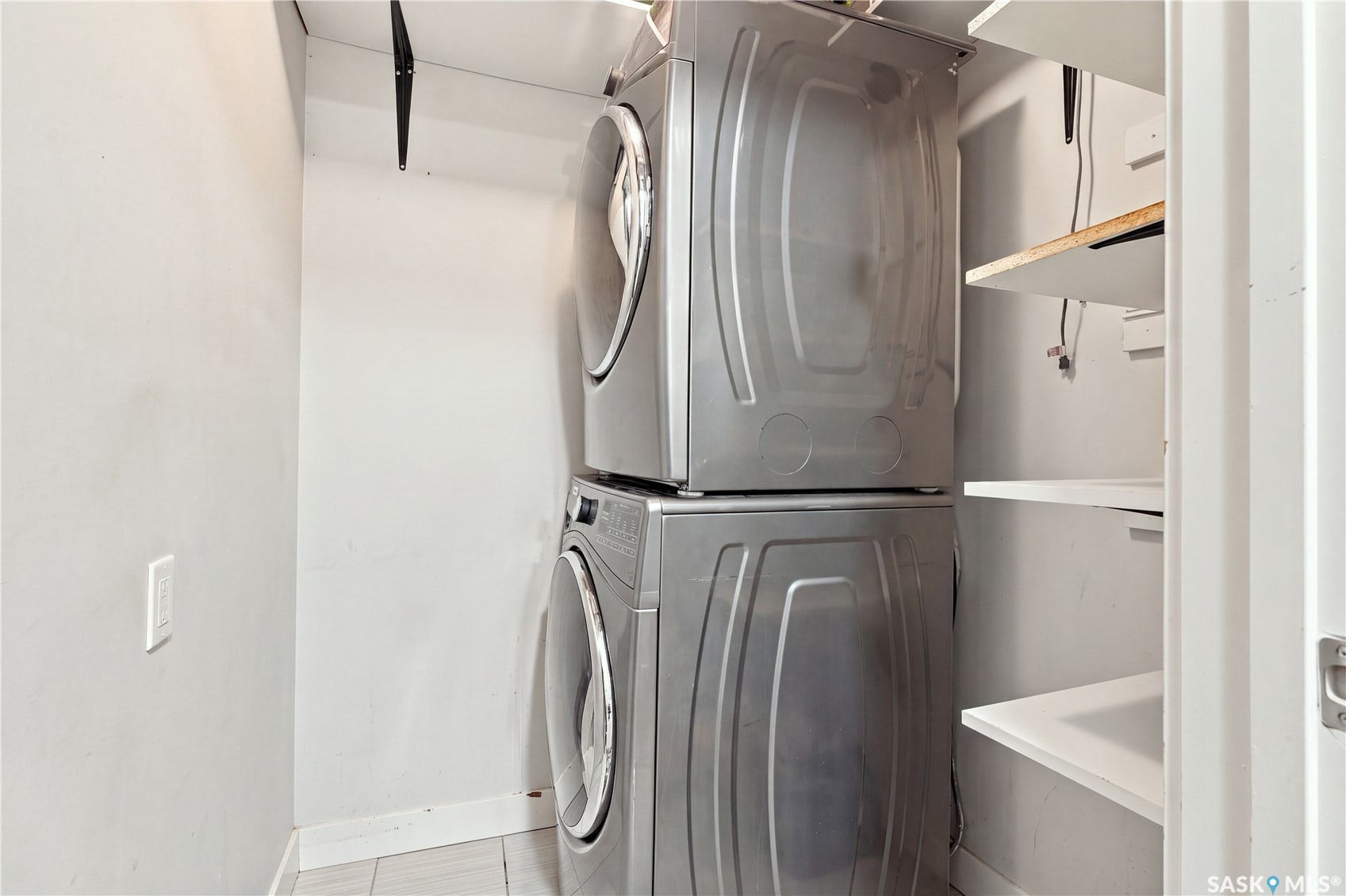 Stackable washer and dryer appliances, dedicated laundry closet, and built-in shelving