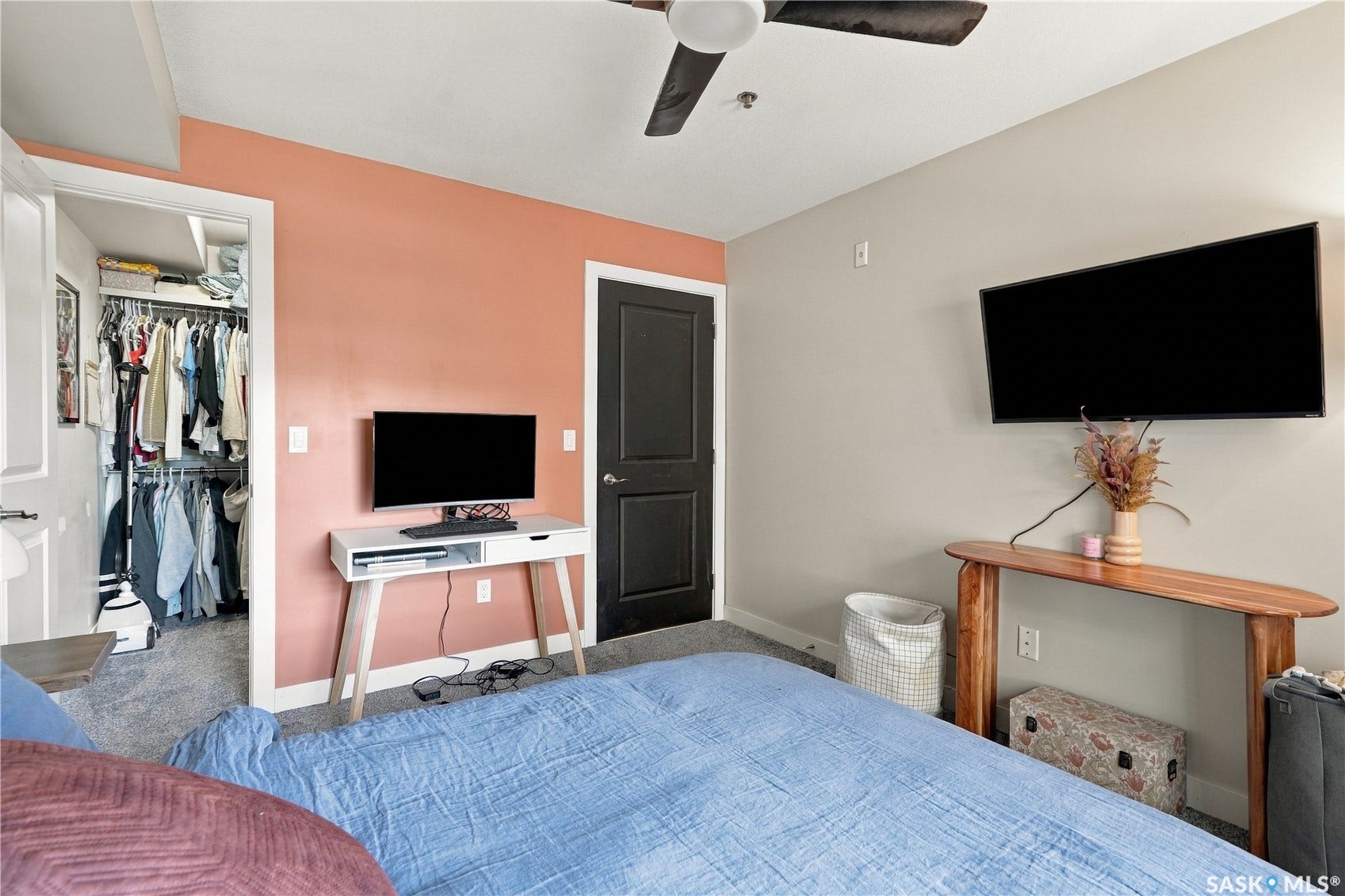 Recessed lighting, wood-finish ceiling fan, and carpeted flooring