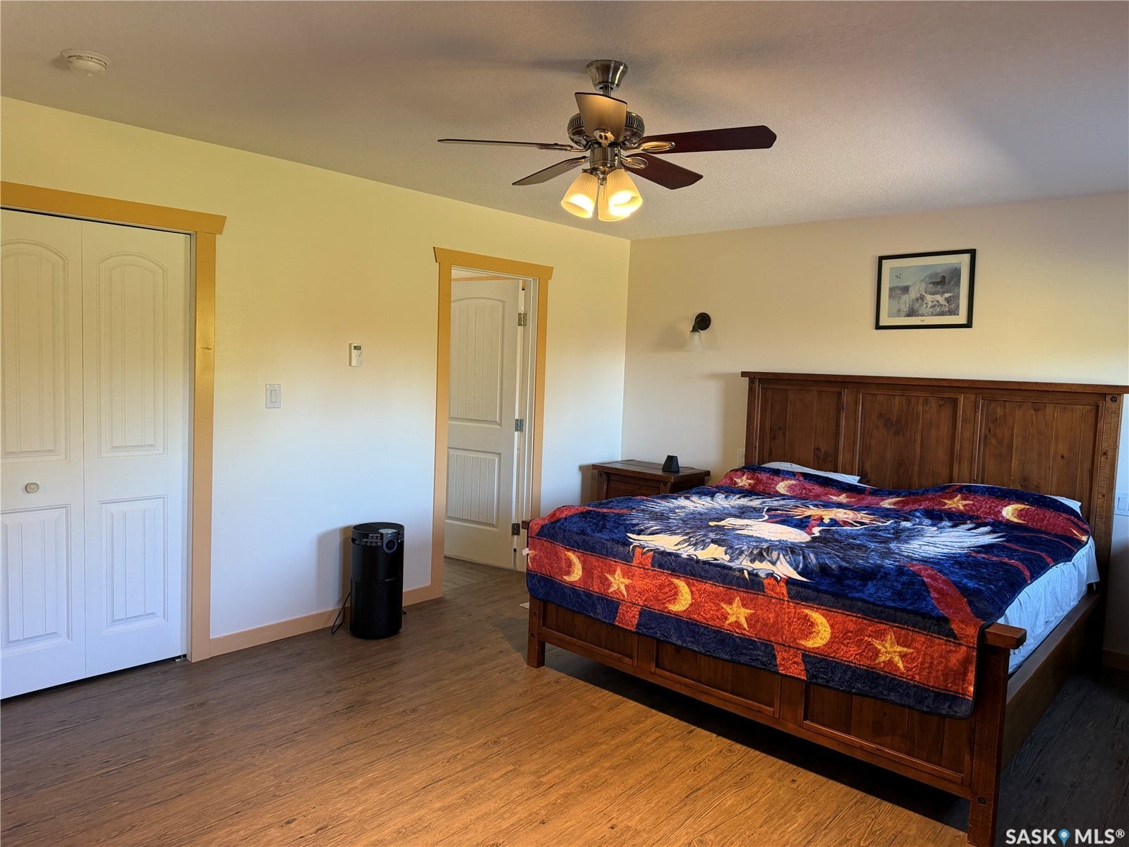 Wood-finish flooring with light-toned walls and wood trim accents