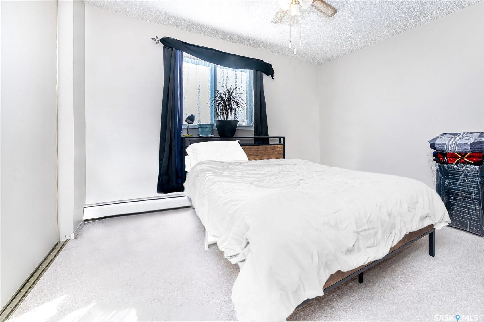 White painted walls and light-colored carpeting