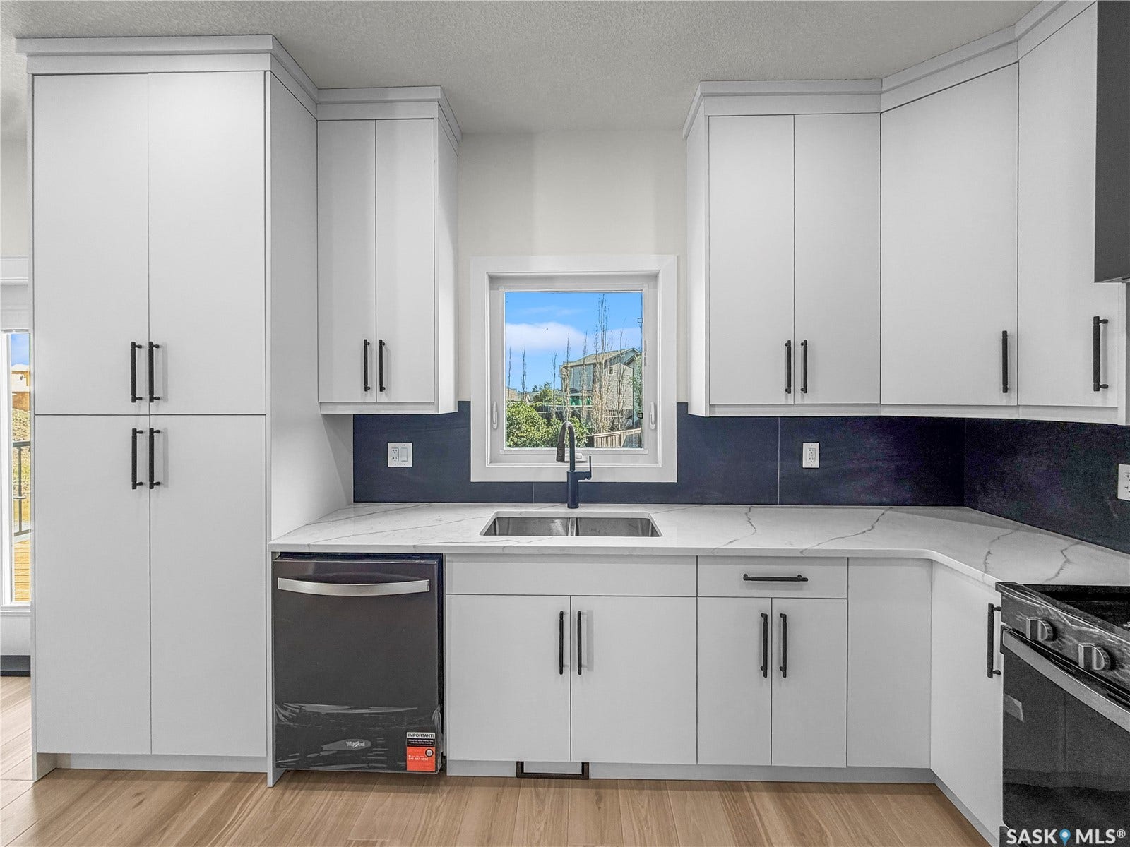 White cabinetry with matte black hardware