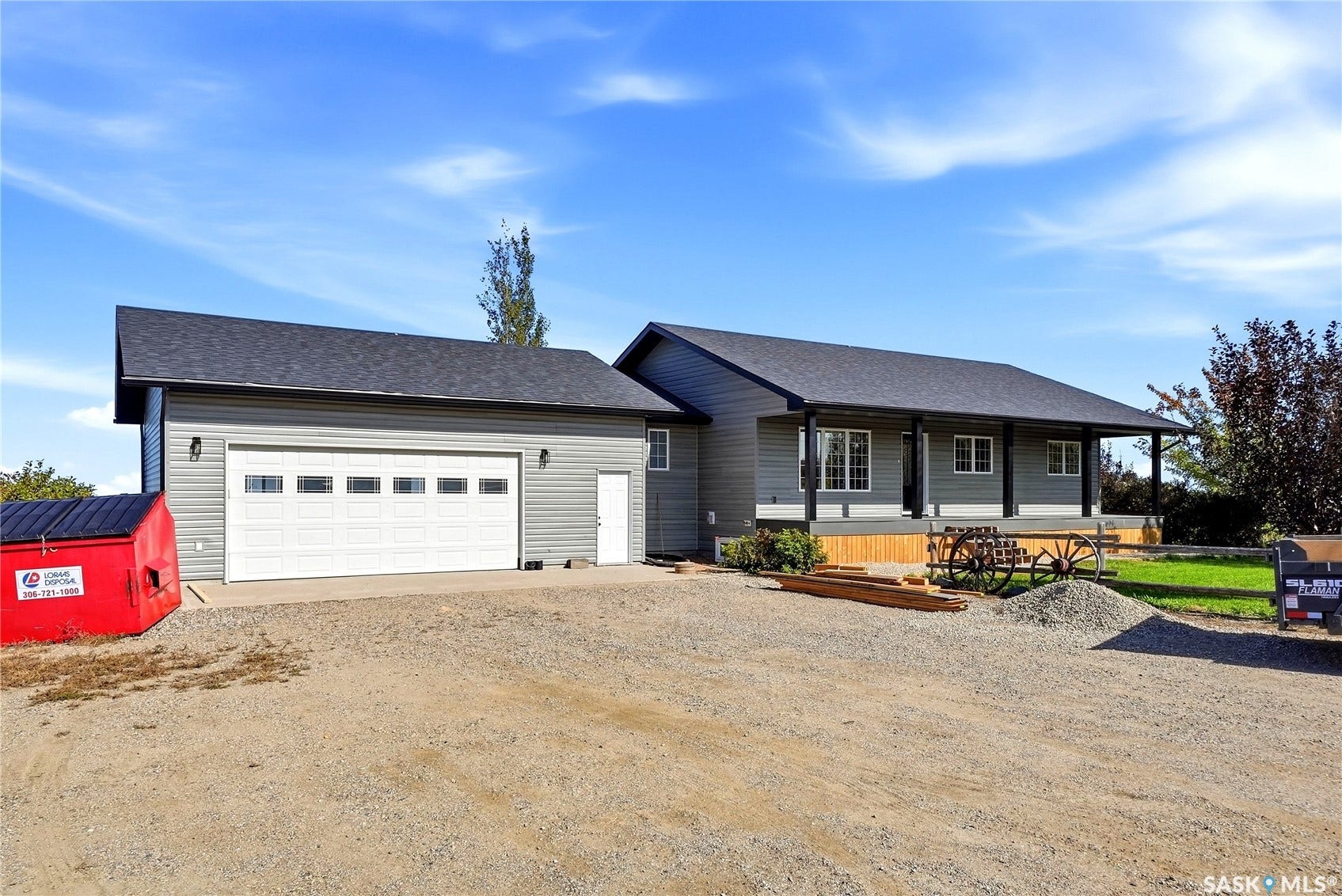 Gray siding exterior with dark asphalt shingle roofing