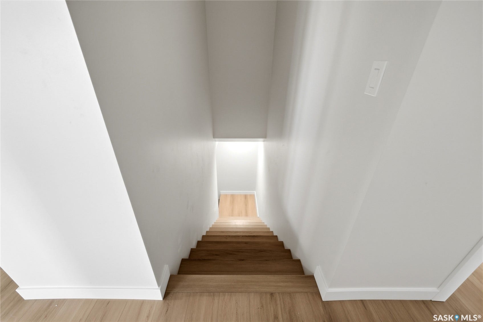 Wood-finish flooring with coordinating stair treads and risers