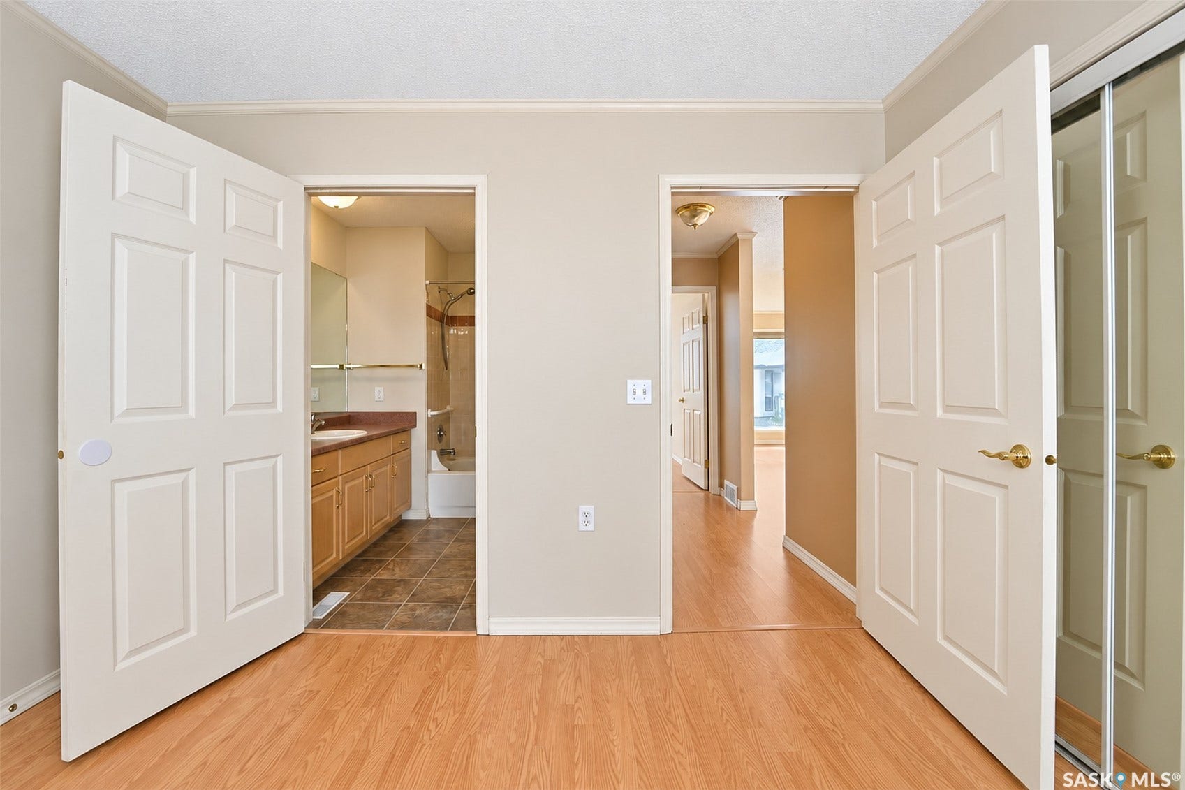 Wood-finish flooring throughout, with neutral wall tones