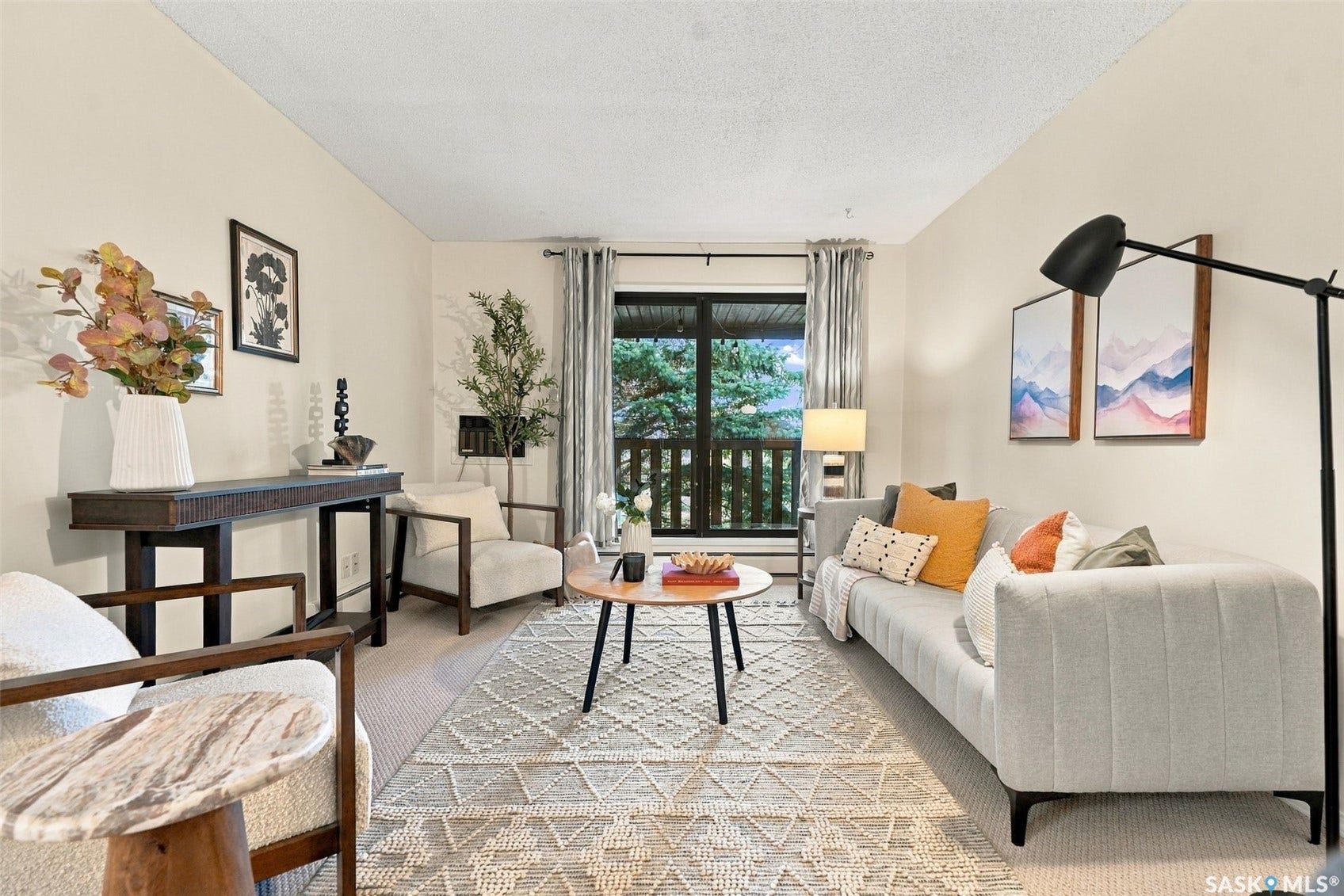 Light-toned walls complement the carpeted flooring