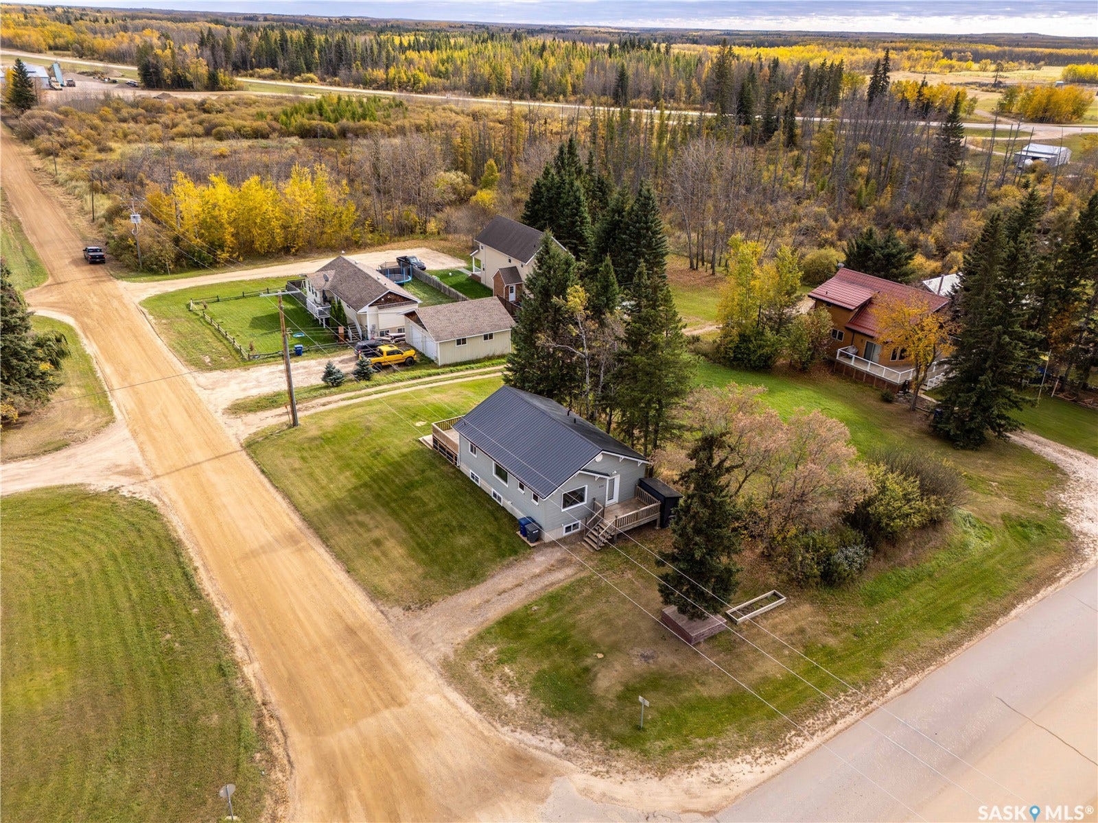 Aerial perspective with established properties, mature trees, and natural surroundings