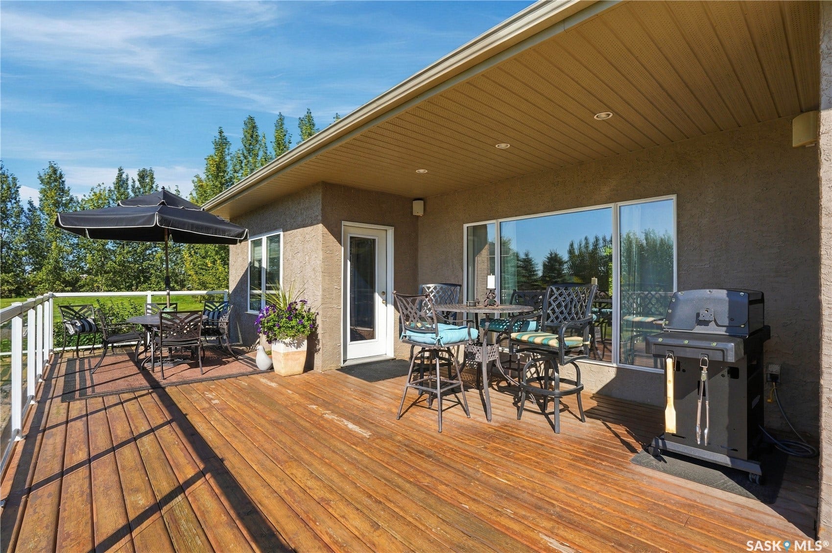 Spacious Upper deck with natural gas bbq outlet  and stairs leading down to lower ground level