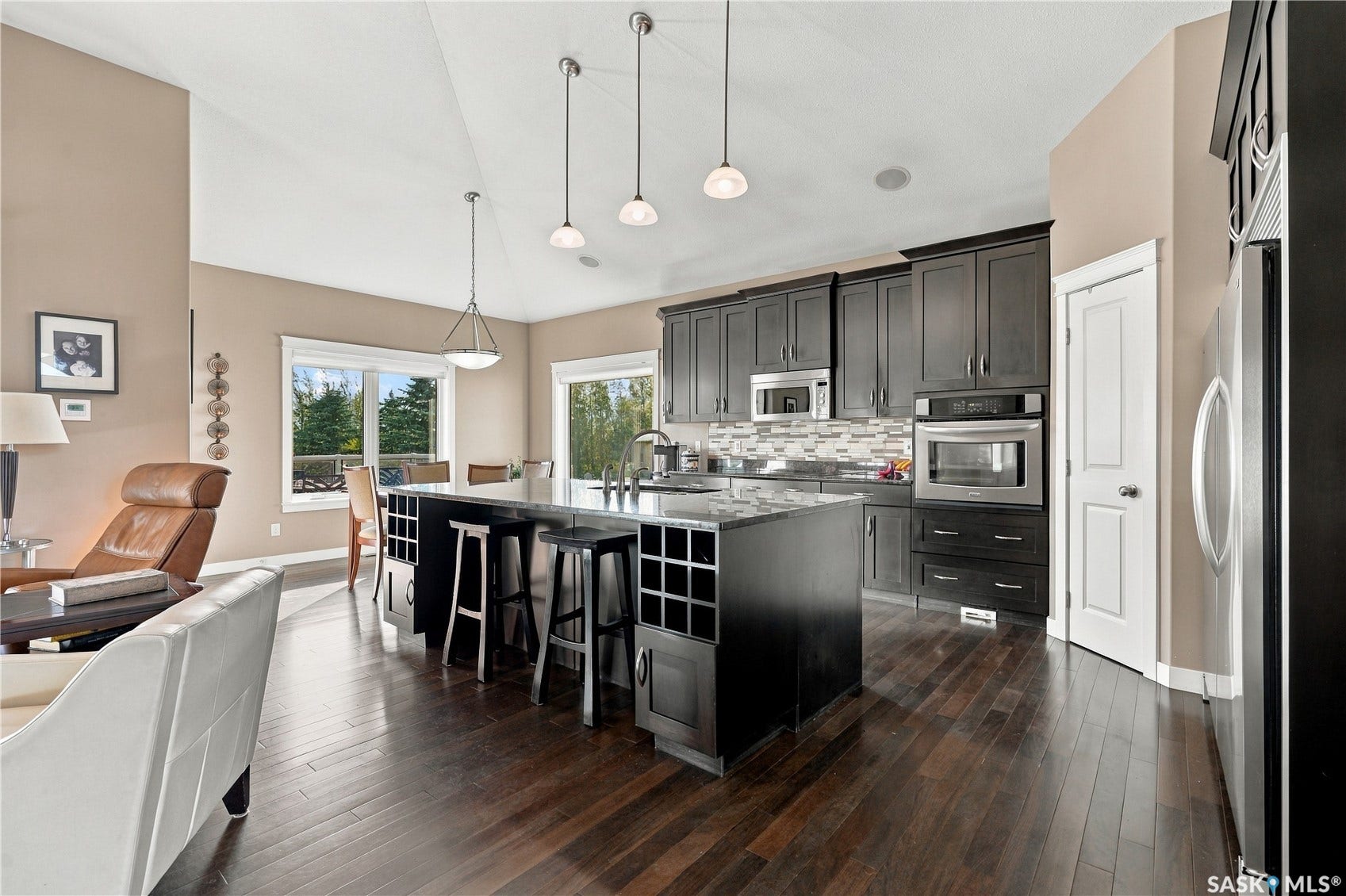 large pull up eating bar with tons of storage and beautiful counter tops