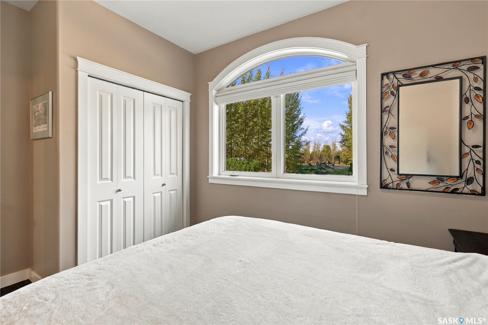 2nd main level bedroom with full closet and large opening window