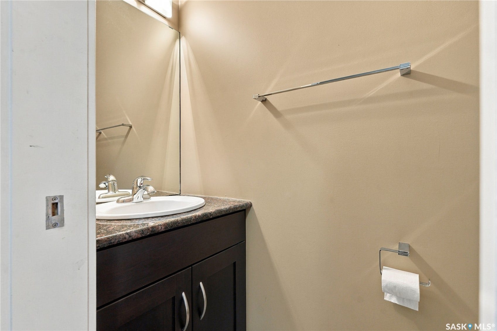 2 piece bathroom by main floor laundry and mudroom area