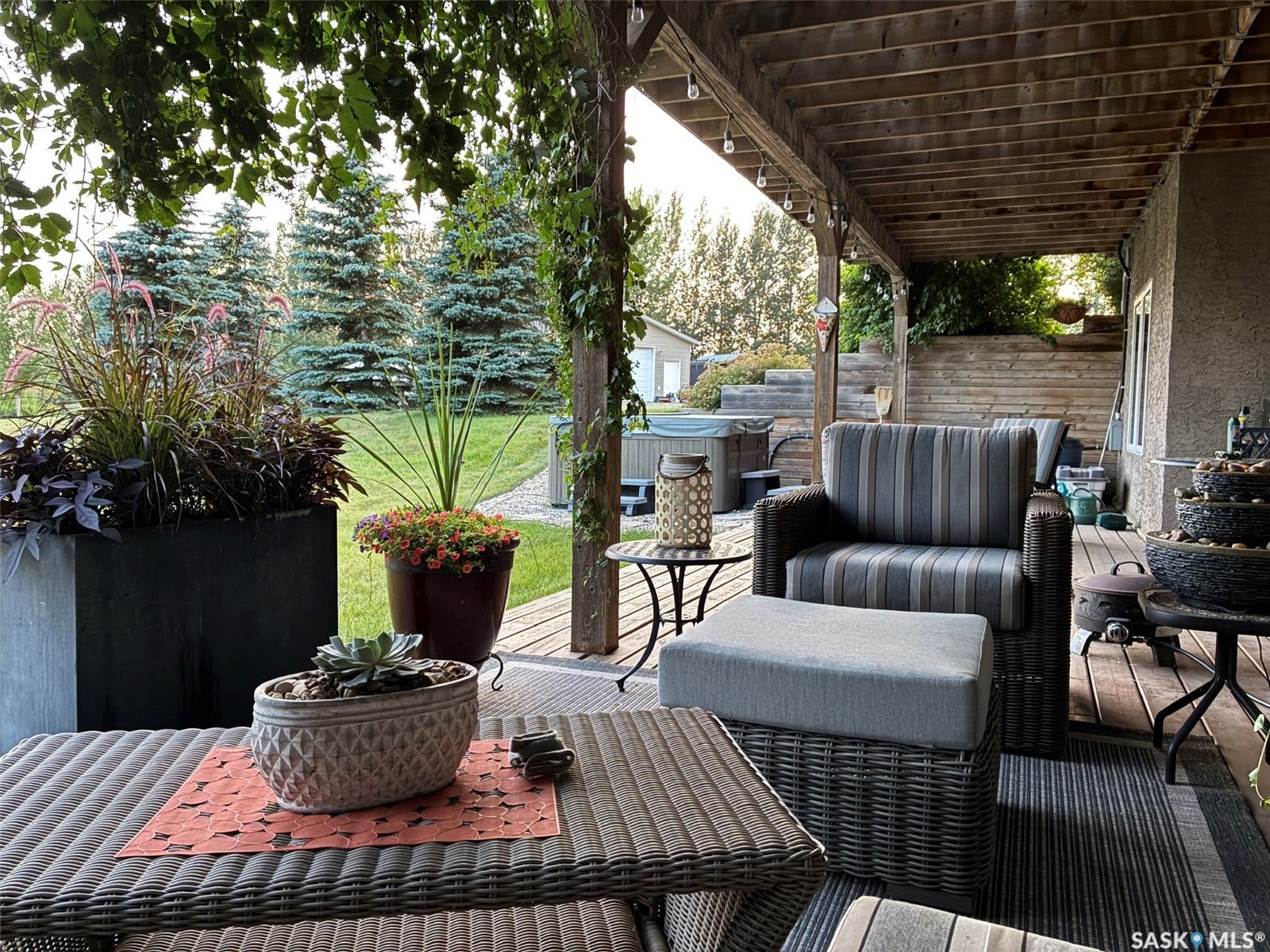 Spacious outdoor lower level patio with an overhead deck, providing a dedicated area for cozy outdoor living