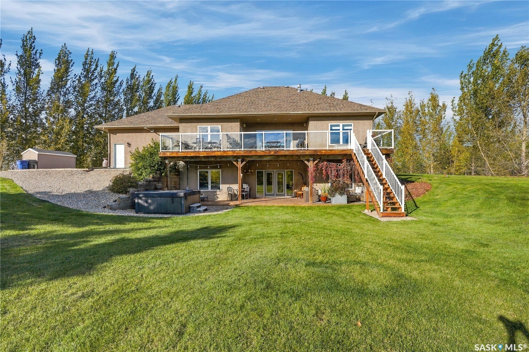 4 bedroom 4 bathroom, South backing Walk out bungalow with a triple attached garage and an oversized double detached double shop with 9 ft overhead door. Meticulously kept 5 plus acre fully treed and manicured yard