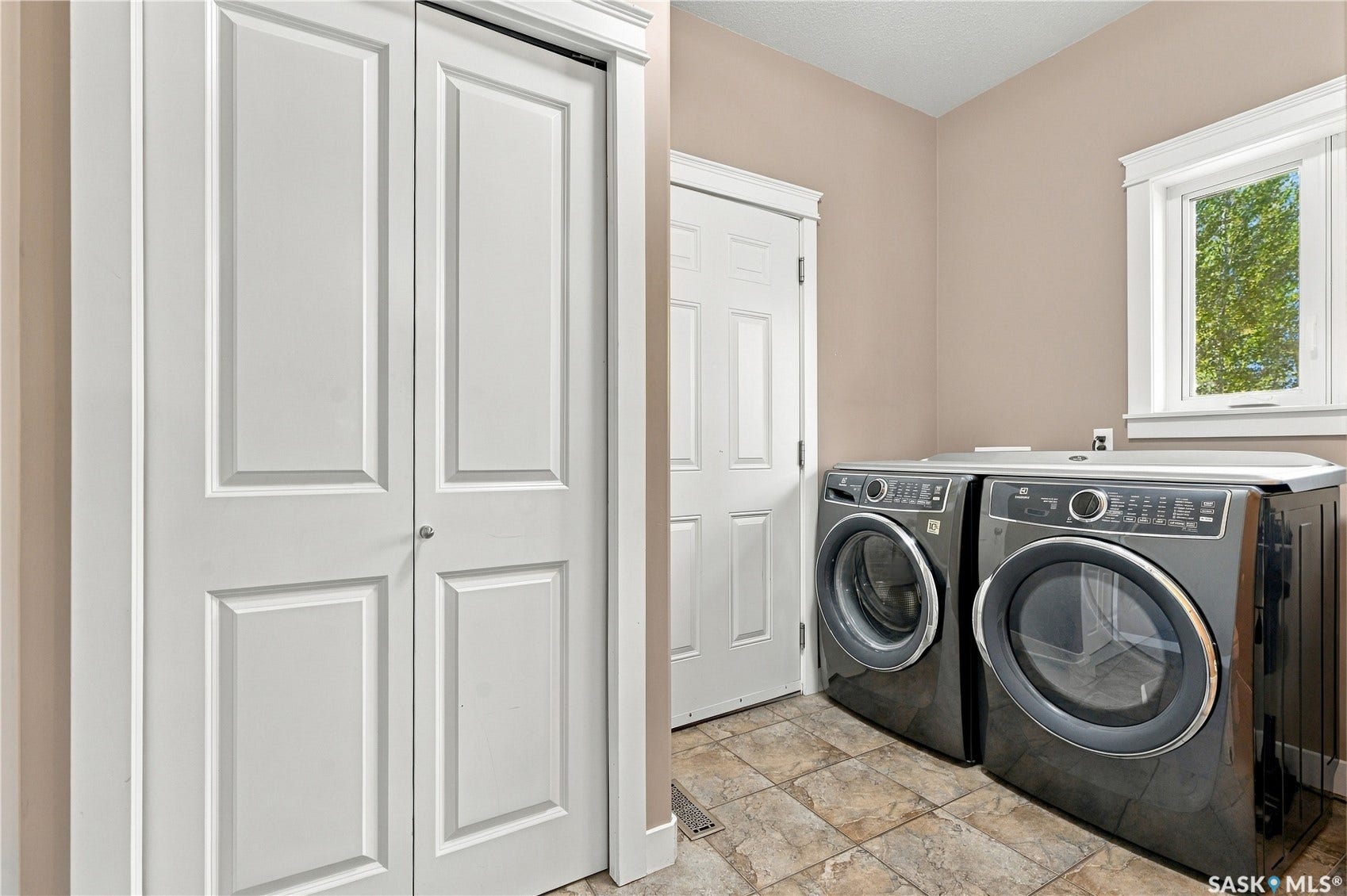 Main floor laundry and entry to garage