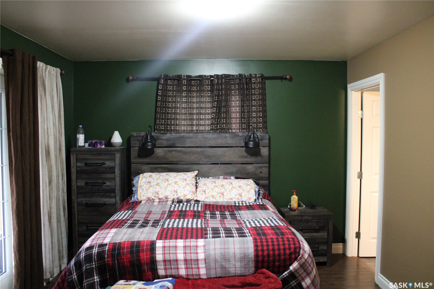 Bedroom with dark hardwood / wood-style floors